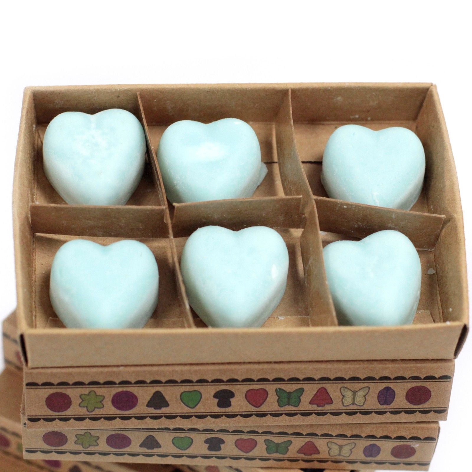 Heart-shaped objects in a decorative box with a patterned base