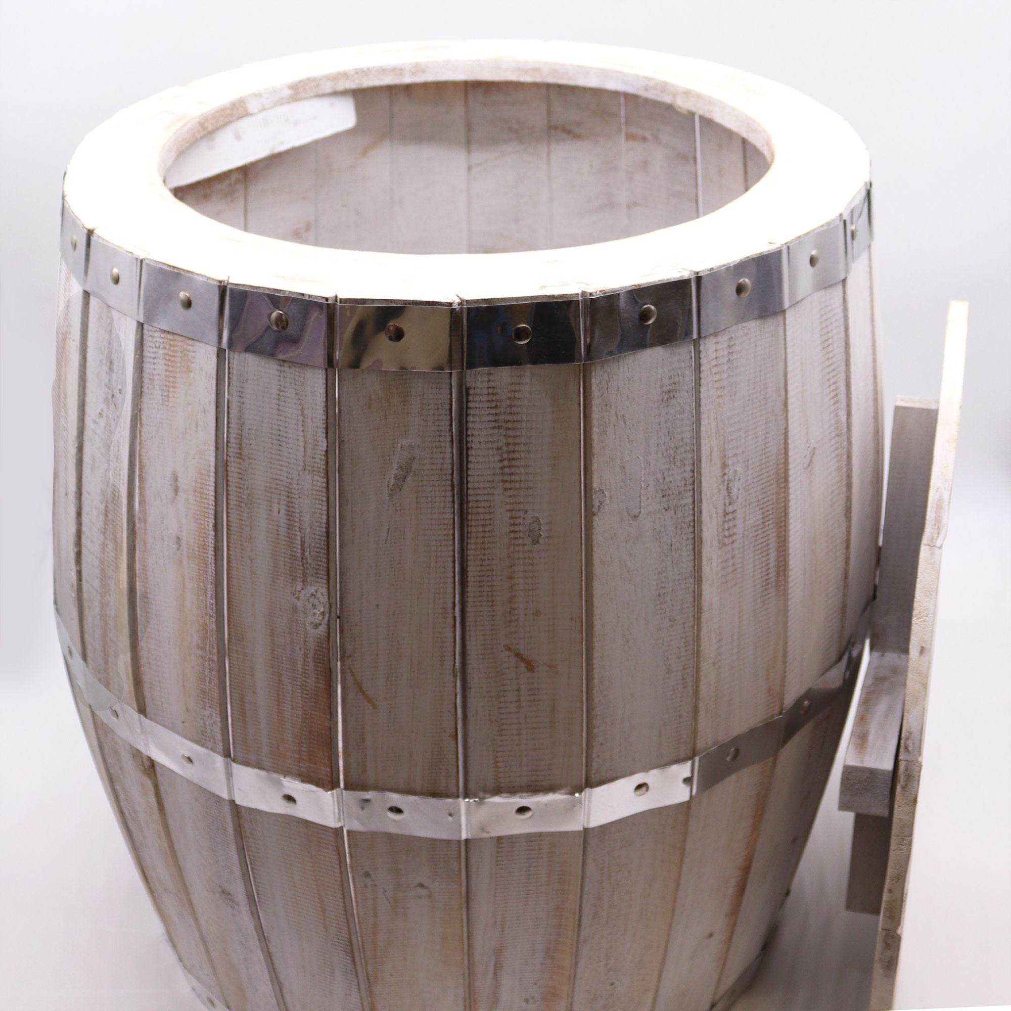 Wooden barrel with metal bands on a white background